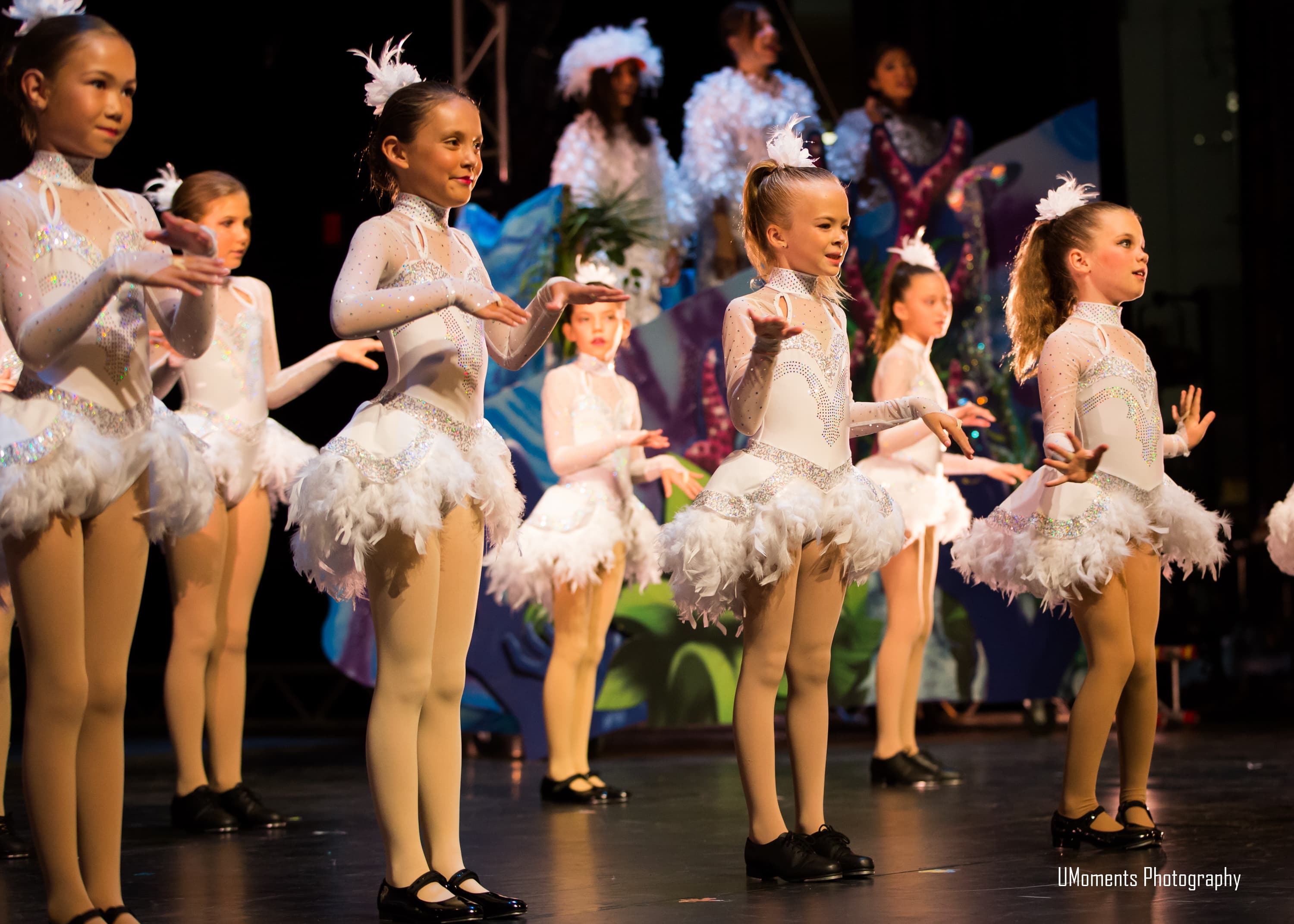 Young dancers performing together on stage